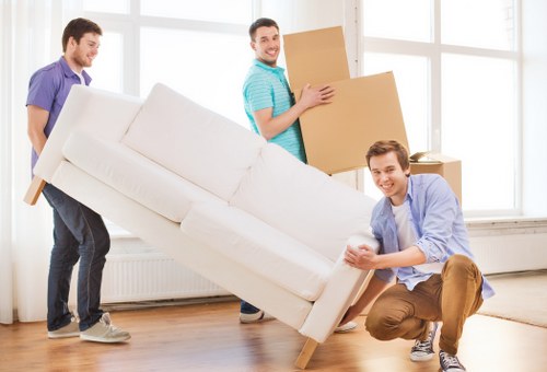 Packed moving boxes ready for transport in a Watford home