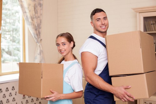 Moving team handling furniture in a Watford property