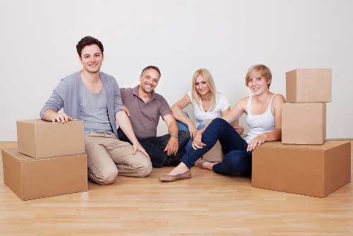 Professional movers loading furniture during a Watford removal