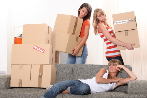Careful loading of old furniture for collection in Watford