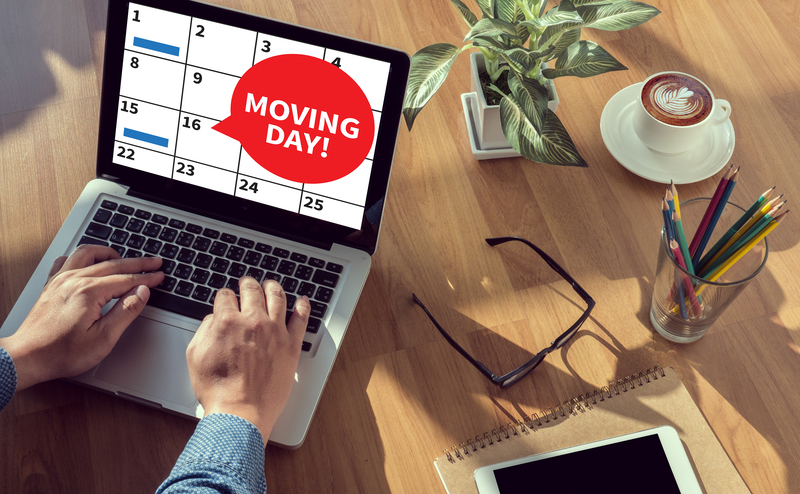 Local office movers handling desks and boxes in Watford